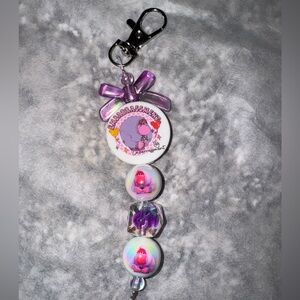 Purple and White Keychain with inside out Cartoon Design